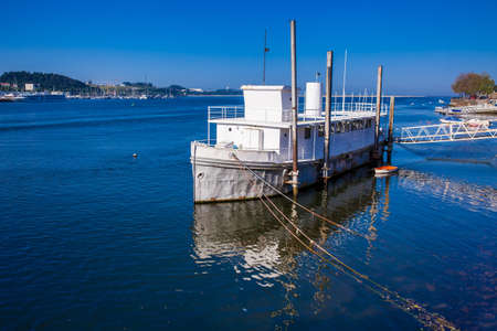 Old ship at Douro River mouth in a beautiful early spring day at Porto City in Portugalの写真素材