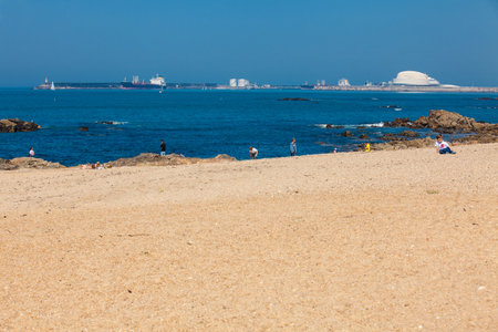 PORTO, PORTUGAL - MAY, 2018:  People enjoying a sunny early spring day at the beautiful beaches along the Porto city coastのeditorial素材