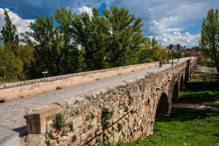 SALAMANCA, SPAIN - MAY, 2018: The historical Roman bridge of Salamanca also known as Puente Mayor del Tormesのeditorial素材