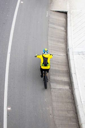Overhead shot of an amateur male cyclist on the road between Bogota and La Calera on the mountains in Colombiaの写真素材