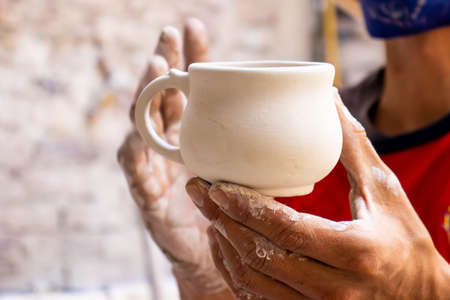 Ceramics on the elaboration process at a traditional factory at the beautiful small city of Raquira in Colombiaの写真素材