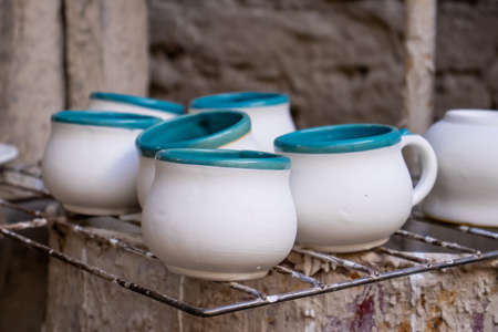Ceramics on the elaboration process at a traditional factory at the beautiful small city of Raquira in Colombiaの写真素材