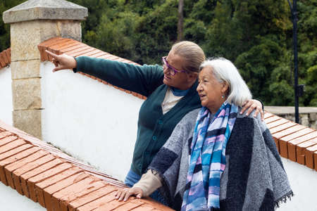 Senior mother and adult daughter traveling. The famous historic Bridge of Boyaca in Colombia. The Colombian independence Battle of Boyaca took place here on August 7, 1819.の写真素材