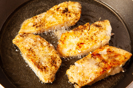 Fish marinade preparation steps: Frying sea bass pieces