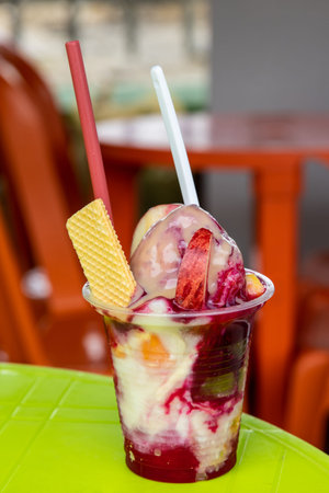 Traditional sweet water ice with fruits called cholado in the city of Cali in Colombia