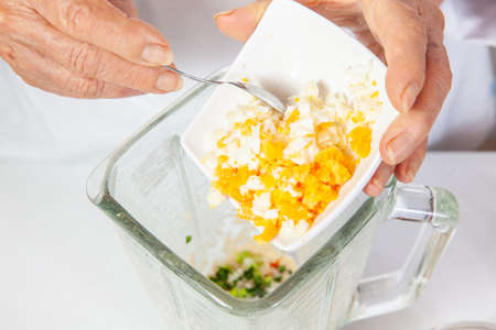 Preparation of the spicy peanut sauce to accompany the traditional patties from the region of Cauca in Colombia, called empanadas de pipiÃ¡nの写真素材