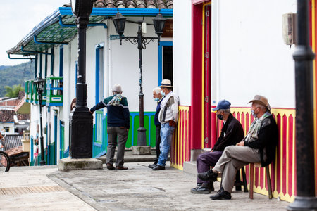 SALENTO, COLOMBIA - JULY 2021. Group of senior men at a beautiful corner in Salento an small town located at the Quindio region in Colombiaのeditorial素材