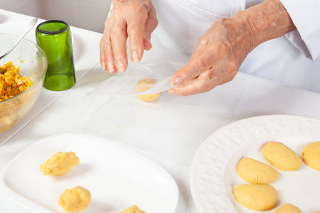 Preparation of the traditional patties from the region of Cauca in Colombia, called empanadas de pipiÃ¡nの写真素材