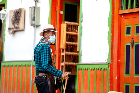 SALENTO, COLOMBIA - JULY 2021. Man dressed with the traditional outfit of the arrieros at the small town of Salento located at the region of Quindio in Colombiaのeditorial素材