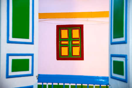 Colorful doors and windows in Salento a beautiful small town located at the Quindio region in Colombiaの写真素材