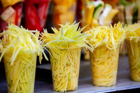 Street sell of mango and other fruits at the beautiful streets of Salento a small town located at the Quindio region in Colombiaの写真素材