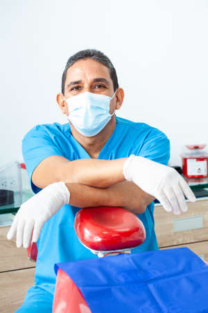 Portrait of a male middle-aged dentist at his officeの写真素材