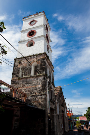 MARIQUITA, COLOMBIA - MAY, 2022: Jose Celestino Mutis square and the bell tower of the San Sebastian Church built between 1553 and 1653 at the town of Mariquita in Colombiaのeditorial素材