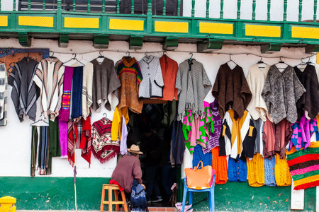 NOBSA, COLOMBIA - AUGUST 2023. Traditional handmade ruanas seller at the beautiful small town of Nobsa in the region of Boyaca in Colombiaのeditorial素材