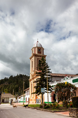Iza, Boyaca, Colombia - August 9th 2023. HIstorical Parish Temple of the Divine Savior built on 1678 at the central square of the beautiful small town of Iza.のeditorial素材