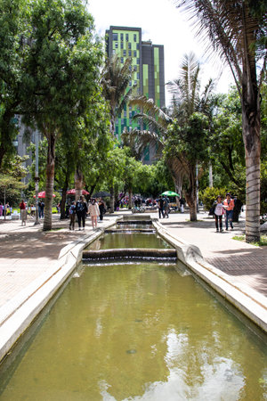 Bogota, Colombia - July 2nd 2023. View of the walking path and fountains of the Environmental Eje in Bogota city center.のeditorial素材