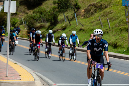 LA CALERA, COLOMBIA - FEBRUARY 11, 2024: Amateur participants at the Tour Colombia cycling race as it passes through the municipality of La Calera in the department of Cundinamarca in Colombiaのeditorial素材