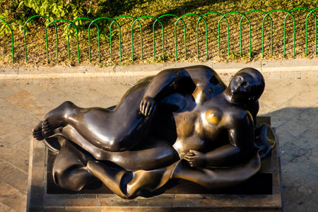 MEDELLIN, COLOMBIA - JANUARY 17, 2024: Reclining Woman. Bronze sculptures by the famous Colombian artist Fernando Botero Angulo in the square that bears his name in the center of the city of Medellin.のeditorial素材