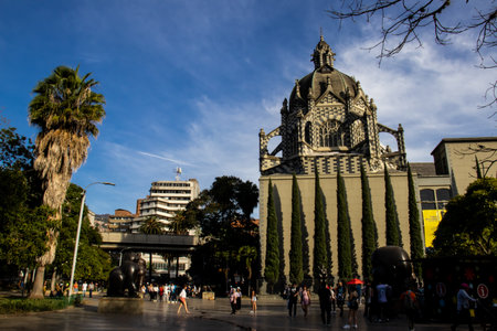 MEDELLIN, COLOMBIA - JANUARY 17, 2024: View of the Rafael Uribe Uribe Palace of Culture and the famous Botero Square in Medellin.のeditorial素材