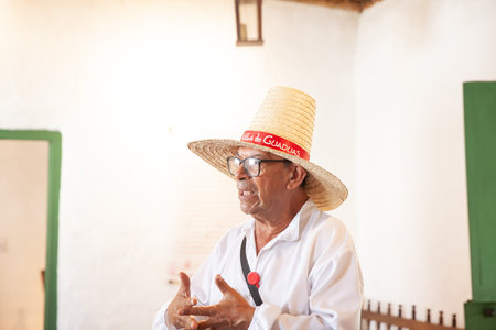 GUADUAS, COLOMBIA - JANUARY 12, 2024: Tourists guide at the natal house of the Colombian independent heroine Policarpa Salavarrieta, also known as La Pola in her hometown.のeditorial素材