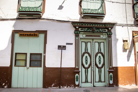 SALAMINA, COLOMBIA - JANUARY 14, 2024: House of culture at the heritage town of Salamina located at the Caldas department in Colombia. Famous devil at entrance door.のeditorial素材