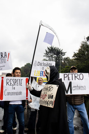 BOGOTA, COLOMBIA - April 21, 2024. March asking for Gustavo Petro impeachment. Peaceful protest march in Bogota Colombia against the law reforms of Gustavo Petro government.のeditorial素材