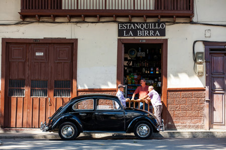 SALAMINA, COLOMBIA - JANUARY 14, 2024: Group of men at the beautiful streets at the historical downtown of the heritage town of Salamina in Colombia.のeditorial素材