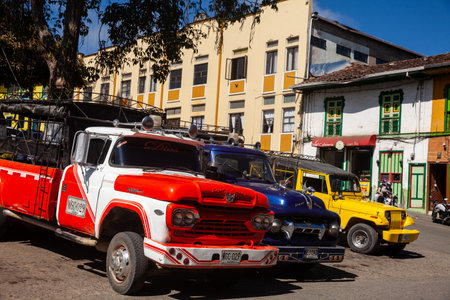 Colorful traditional vehicles at the central square of the historical heritage town of Aguadas located at the Caldas department in Colombia.のeditorial素材