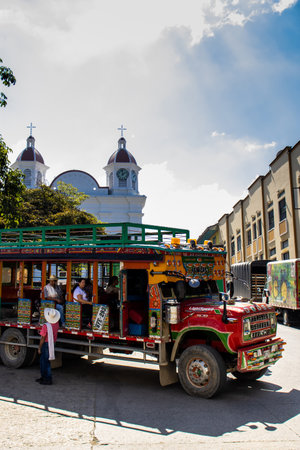 AGUADAS, COLOMBIA - JANUARY 15, 2024: Traditional colorful rural bus called chiva at the historical heritage town of Aguadas located at the Caldas department in Colombia.のeditorial素材