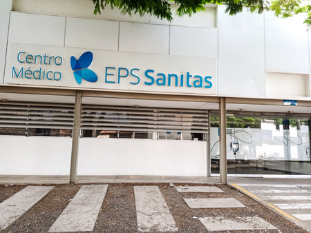 CALI, COLOMBIA - JUNE 02, 2024: Facade of a closed SANITAS EPS health care center. Closed EPS concept.のeditorial素材