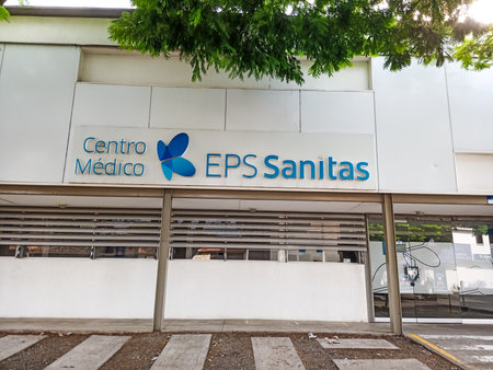 CALI, COLOMBIA - JUNE 02, 2024: Facade of a closed SANITAS EPS health care center. Closed EPS concept.のeditorial素材