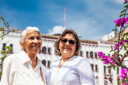 Senior mother and daughter traveling together having fun. Senior adults in Cali Colombia. Senior...