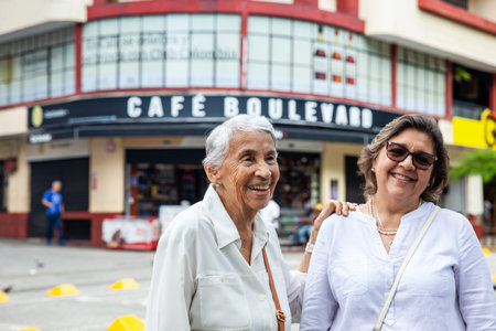 Cali, Colombia - June 17, 2024: Senior mother and daughter traveling together having fun. Senior...