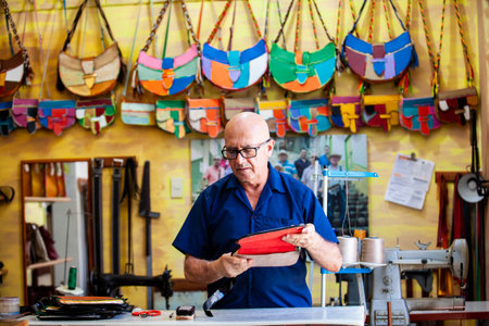Jerico, Colombia - January 16, 2024: Famous saddlery workshop in the beautiful heritage town of Jerico in the department of Antioquia. Elaboration of traditional carriel.のeditorial素材