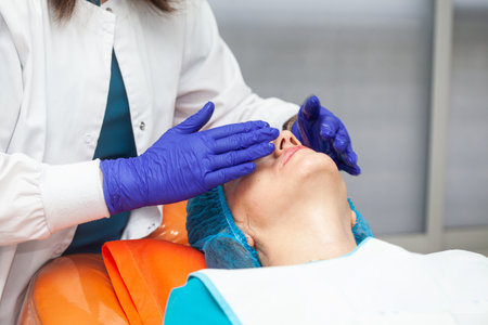 Application of an anti-aging facial rejuvenation cocktail using micro needles. Dermatology concept. Aesthetic medicine concept.の写真素材