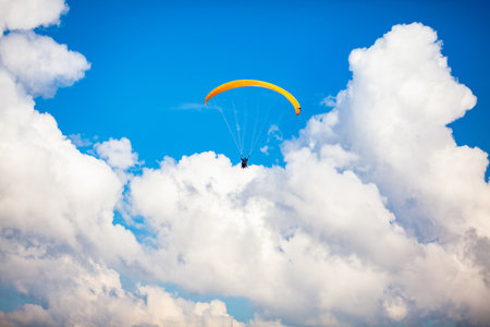 People paragliding over the beautiful mountains of the Antioquia department in Colombia. Tandem Paragliding. Extreme sport concept.の写真素材