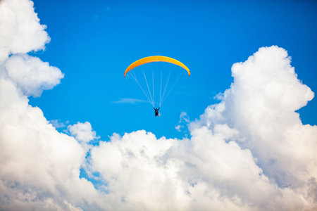 People paragliding over the beautiful mountains of the Antioquia department in Colombia. Tandem Paragliding. Extreme sport concept.の写真素材
