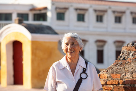 Active senior concept. Senior travel concept. Senior lifestyle. Senior woman tourist in Cartagena de Indias.の写真素材
