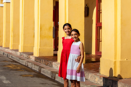 Beautiful young girls tourist in Cartagena de Indias. Colombian people. Travel concept. Real sisters.の写真素材