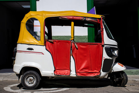 Motor-tricycle at the beautiful streets of the Heritage Town of Jerico located in the Department of Antioquia in Colombia.の写真素材