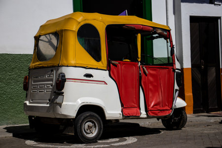 Motor-tricycle at the beautiful streets of the Heritage Town of Jerico located in the Department of Antioquia in Colombia.の写真素材