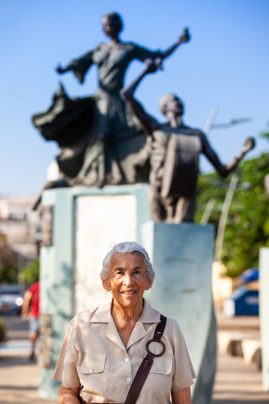Senior woman traveling at the Ronda del Sinu linear park of Monteria in the department of Cordoba, Colombia.の写真素材