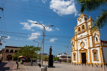 View of the Simon Bolivar Park and the beautiful historical Cathedral of Santa Cruz de Lorica a cultural symbol founded in 1700.の写真素材