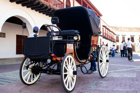 Cartagena de Indias, Colombia - 26 January 2024. New electric cars that will replace the traditional horse drawn carriages in the Walled City.のeditorial素材