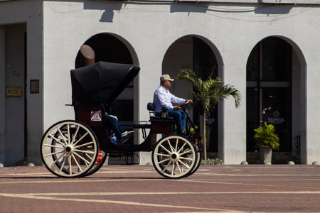Cartagena de Indias, Colombia - 26 January 2024. New electric cars that will replace the traditional horse drawn carriages in the Walled City.のeditorial素材