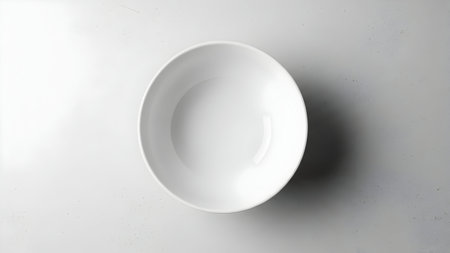 Clean white bowl, ceramic dish, top down view, minimalist design, kitchenware, empty container, simple kitchen itemの素材