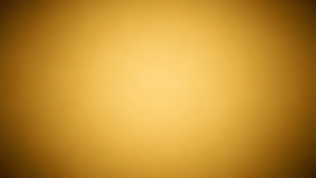 Rich golden yellow gradient background with a soft, bright center and darker, blurred edges for an inviting glow.の素材