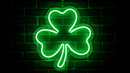 Bright light up shamrock symbol outlined in neon tubing against textured black brick backgroundの素材
