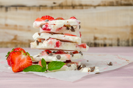 Homemade healthy frozen strawberry yogurt bark. Top viewの写真素材