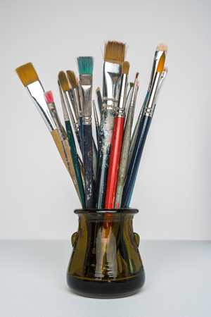 Photo of artist paint brushes in a jarの写真素材